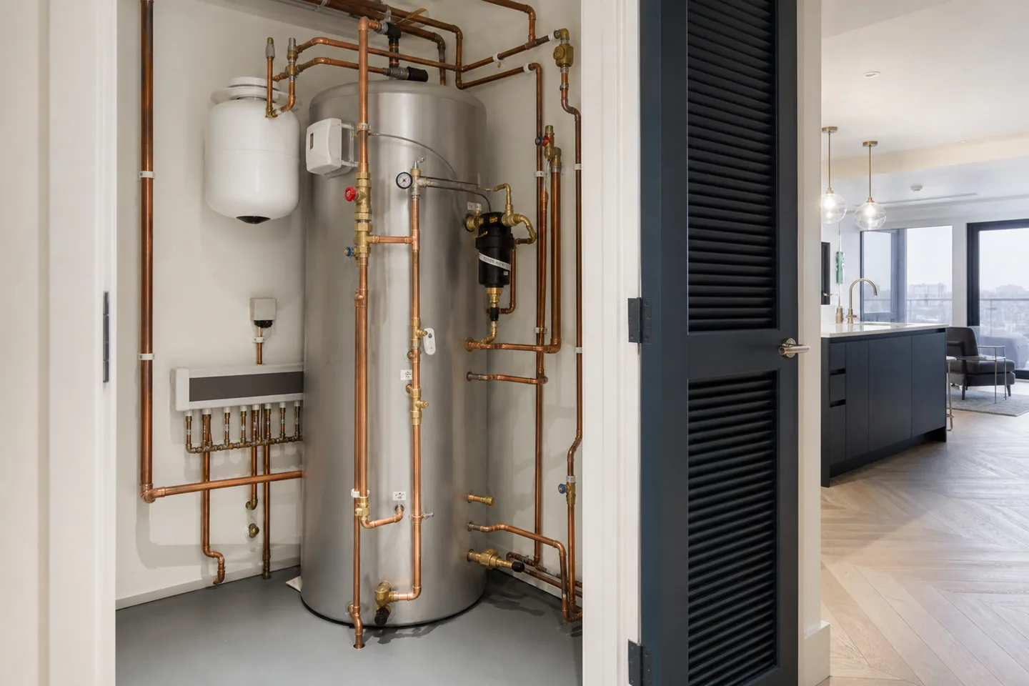 Completed hot-water system installation with neat pipework